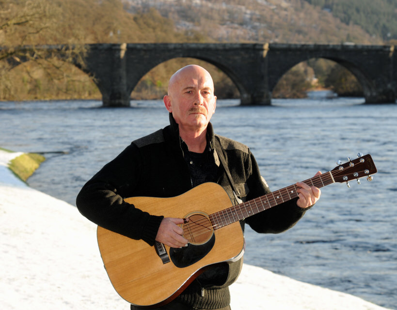 Fraser Nimmo plays by a river